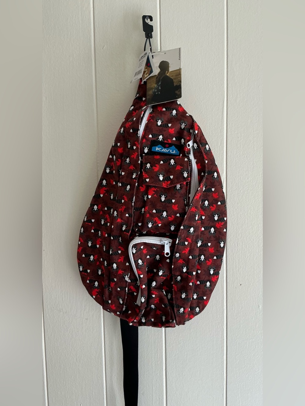 A NWT KAVU Rope Sling back Crossbody Raccoon Fall Leaves Red Backpack Bag